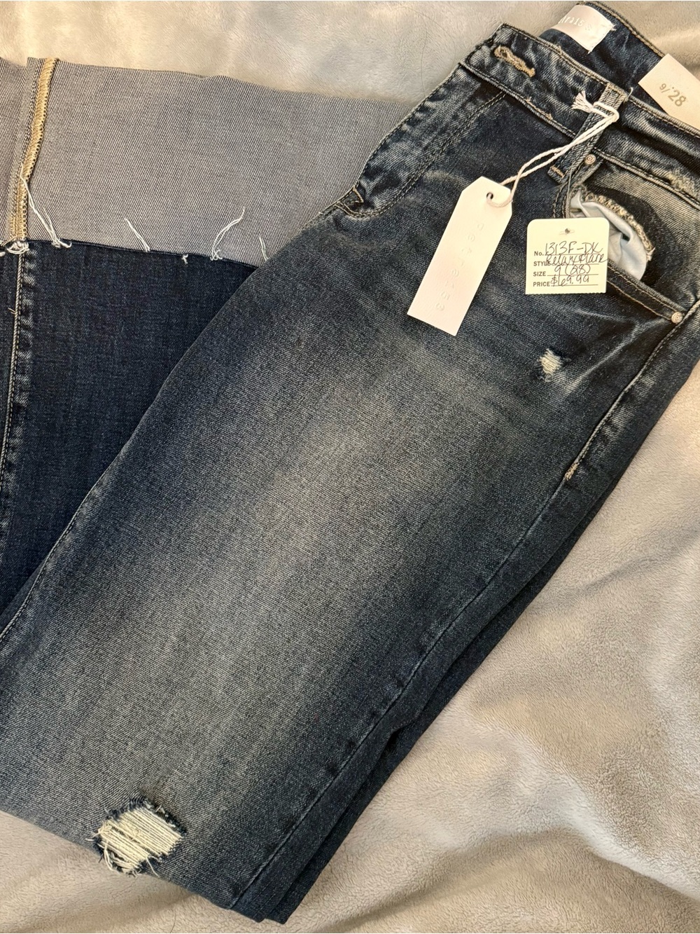 Petra High-Rise Dark Blue Flare Jeans with Distressed Hem Cuffed